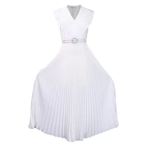 Detailed view of white pleated maxi dress featuring ruffles and sparkling belt buckle.