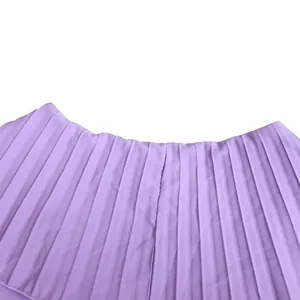 Macro view of light purple pleated fabric showing detailed texture and ruffle design.