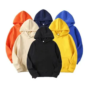 Macro view of multiple colorful fleece hoodies in orange, beige, blue, and black.