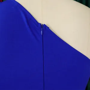 Close-up view of the high-quality invisible back zipper on a royal blue one-shoulder jumpsuit