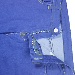 Close-up showing the durable metal zipper and button fly on women's blue denim jeans.