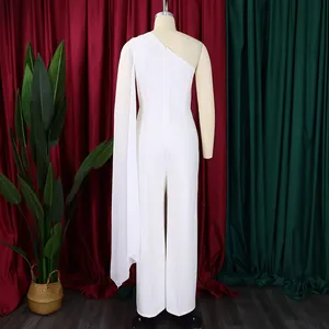 Back view of an elegant white one-shoulder jumpsuit with a flowing chiffon cape sleeve.