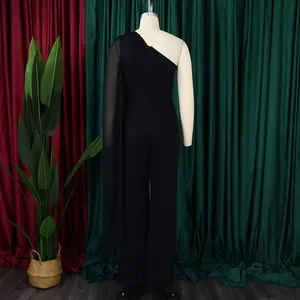 Back view of elegant black one-shoulder jumpsuit with long chiffon drape detail.