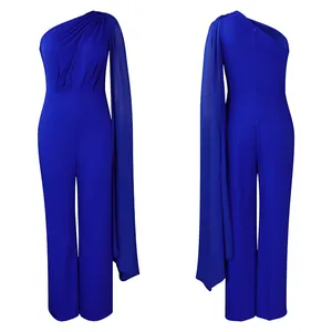Front and back view of elegant royal blue one-shoulder jumpsuit with draped cape detail