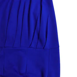 Close-up of pleated detail and fabric texture on a royal blue evening jumpsuit