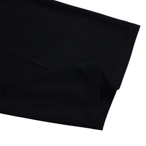 Macro view showing the high-quality stitching and smooth black fabric of the formal jumpsuit