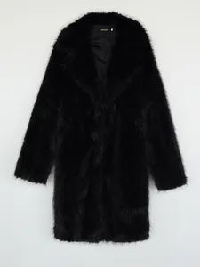 Detailed studio shot of a women's black faux fox fur long coat with plush texture
