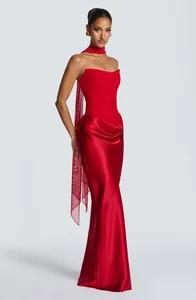 Elegant red strapless satin evening gown with bodycon fit and matching mesh scarf detail