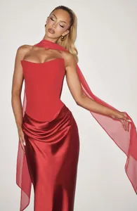 Elegant red strapless satin maxi dress with a long matching neck scarf detail