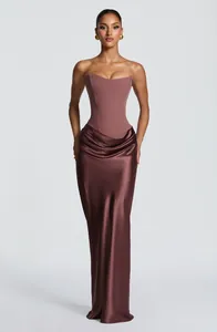 Elegant strapless corset gown with draped satin skirt in chocolate brown finish.