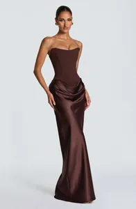 Full view of chocolate brown strapless satin evening gown with draped hip detail.