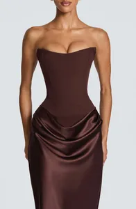 Detail view of a chocolate brown strapless corset dress with elegant satin draping