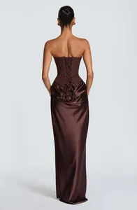 Back view of elegant chocolate satin corset gown with lace-up detail and floor-length hem