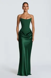 Elegant emerald green strapless satin evening gown with corset bodice and draped skirt.