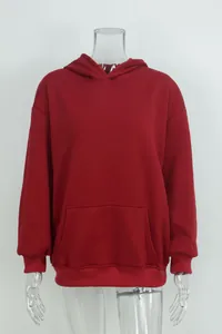 Detailed front view of an oversized red hooded sweatshirt with a front kangaroo pocket.