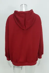 Back detail view of a burgundy oversized hooded sweatshirt shown on a transparent mannequin
