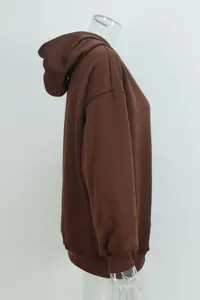 Professional side view detail of a brown oversized hooded sweatshirt on a mannequin