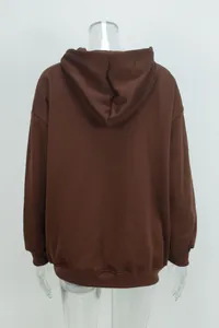 Back view of a brown oversized hooded sweatshirt with a clean minimalist design.