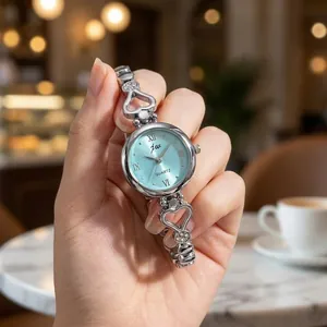Elegante orologio JW da donna in argento con bracciale a cuore e quadrante azzurro