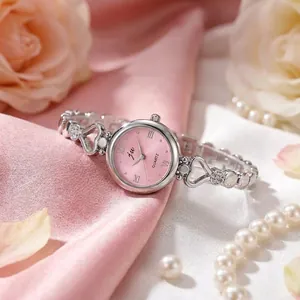 Elegante orologio a bracciale cuore JW argento con quadrante rosa e numeri romani per donna.