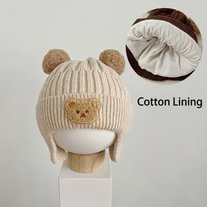 Detail view of the soft cotton lining inside the baby bear earflap knit hat