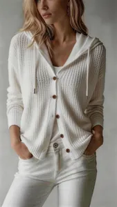 Detailed shot of a lightweight white knitted hooded cardigan for women with buttons.