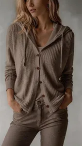 Detail view of women's taupe hooded knit cardigan with button closure