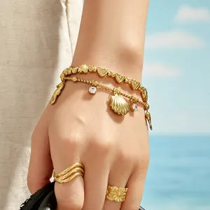Bracelet en acier inoxydable doré avec perles cœur et pendentifs coquillage et dauphin