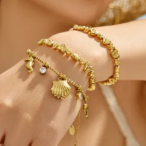 Bracelets élégants en acier doré 18k avec perles cœur et breloques océaniques