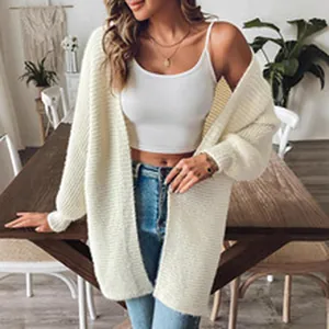 Detail view of a white mohair cardigan featuring soft knit texture and relaxed oversized fit