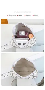 Interior view of small printed crossbody bag showing capacity for daily essentials