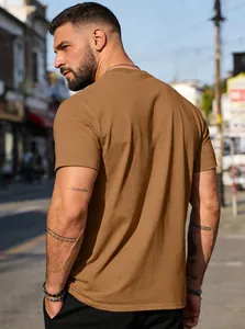 Back view of a plain brown cotton t-shirt with a classic crew neck and short sleeves