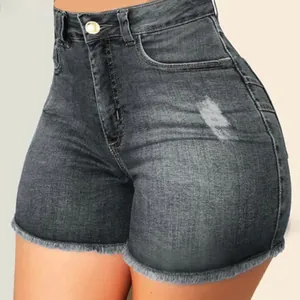 Close-up detail of high-waisted slim stretch denim shorts with frayed hem and distressing