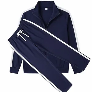 Detail of men's navy blue tracksuit set with contrast white stripes and drawstring