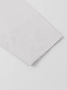 Close-up detail of cotton linen men's casual shirt showing fine fabric texture and stitching