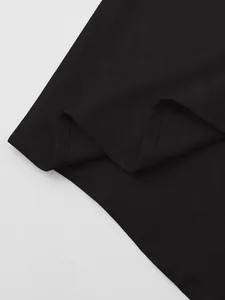 Detail view of premium black cotton linen fabric showing fine weave texture and stitching.
