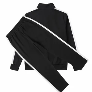 Detail view of men's black tracksuit set with contrast side stripes and stand collar