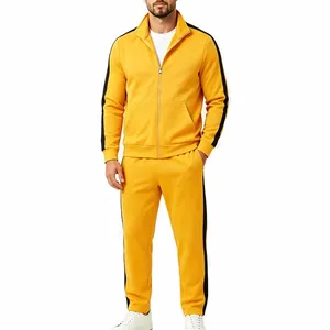 Full view of men's yellow tracksuit with black side stripes on a stand-up collar jacket.