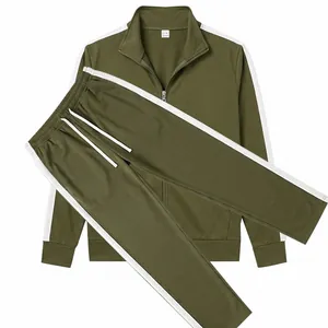 A detailed flat lay of an olive green men's sports tracksuit with white stripes