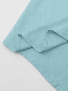 Detailed view of the breathable light blue cotton linen fabric and high quality stitching