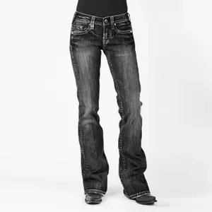 Full view of vintage black mid-rise flare jeans for women with slim fit stretch denim.