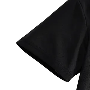 Close-up detail of black breathable pique mesh fabric on a short sleeve polo shirt