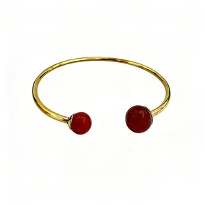 Elegant 18K gold-plated stainless steel cuff bracelet featuring round red gemstones