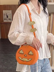 Detailed view of a creative Halloween pumpkin crossbody bag styled with a white shirt