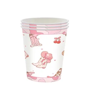 Detailed view of pink cowgirl theme disposable paper cups with boot and hat illustrations