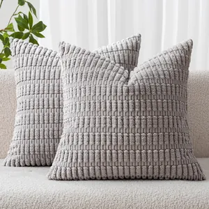 Close-up of gray corduroy pillow covers with a textured wheat ear ribbed pattern