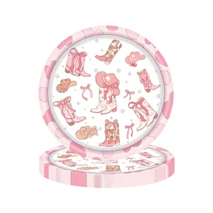 Detail view of pink cowgirl themed party paper plates with boot and hat illustrations