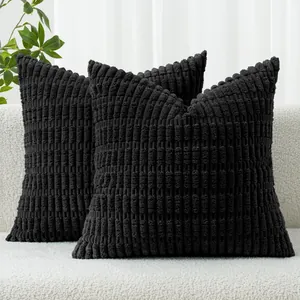 Detailed view of black corduroy throw pillow covers featuring decorative wheat ear texture