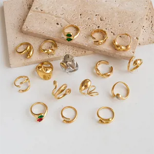 Macro view of diverse gold and silver plated stainless steel rings in geometric styles