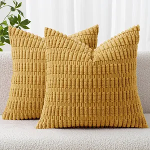 Detail view showing the soft wheat ear textured pattern of mustard yellow corduroy pillowcases